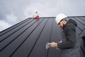 Professional roofer performing a storm damage roof inspection on a Tampa home